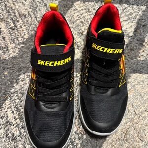 Skechers Kids Black Sneakers with Red and Yellow Accents